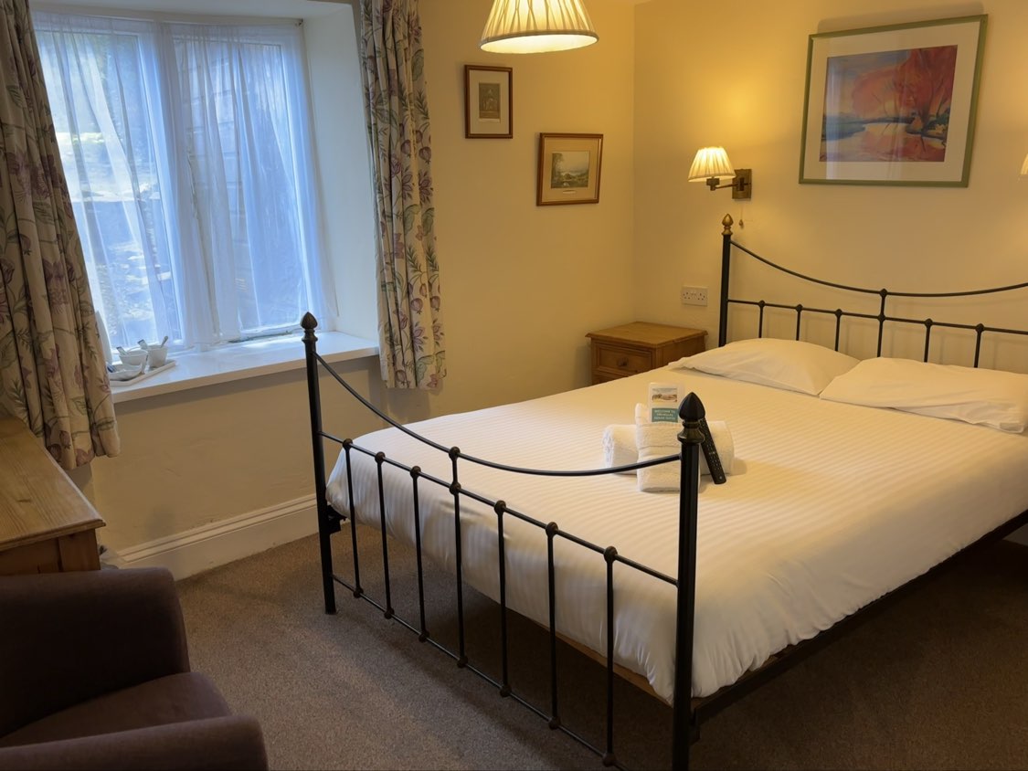 Gallery A classic double bedroom at Trehellas House